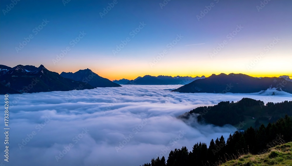 Fototapeta premium Sunrise over a sea of clouds, alpine peaks