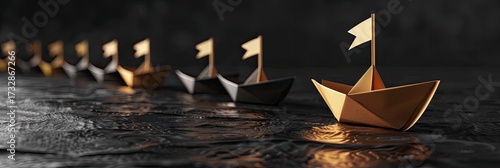 A series of origami paper boats, varying in color, sail in a line on a dark, textured surface, reflecting the warm light.  The foremost boat, a golden hue, leads the others