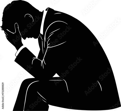 Silhouette of a man in a suit sitting with his head in his hands, conveying a sense of distress or deep thought