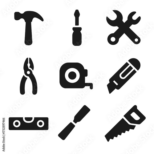 Solid Tool Icons. Solid style icons of basic hand tools: hammer, screwdriver, wrench, pliers, tape measure, utility knife, level,