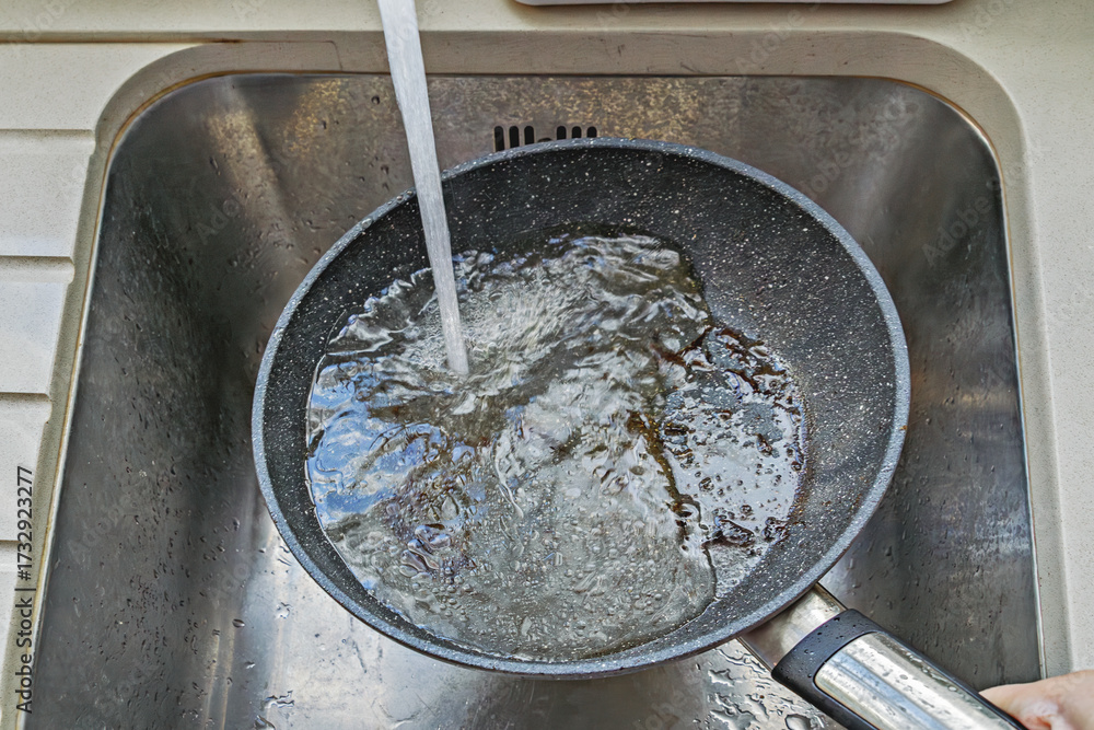 custom made wallpaper toronto digitalHot nonstick pan under tap with water stream and foam, burnt bits washing away, active rinsing step of cleaning
