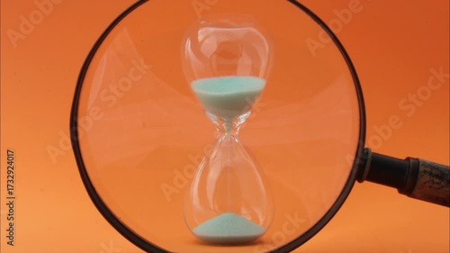 Magnifying glass searches and finds an hourglass