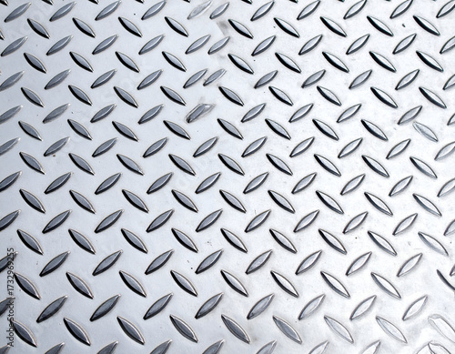 Wallpaper Mural Shiny silver diamond plate metal texture close-up. Ideal industrial background for construction, safety, heavy industry themes, and graphic design projects. Torontodigital.ca