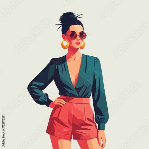 Stylish woman with a messy bun and sunglasses posing in a teal blouse and pink shorts.