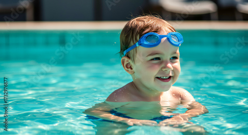 Little Child Enjoying Summer Swimming in Pool