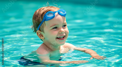 Little Child Enjoying Summer Swimming in Pool