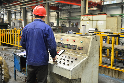 Workers on the production line of the strip steel coil factory are working