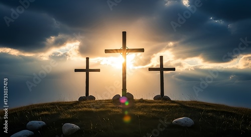 Three crosses stand on a hilltop silhouetted against a stunning sunset sky symbolizing faith, hope, and remembrance this Easter season