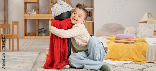 Little girl hugging electri...