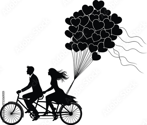 Romantic silhouette of a couple riding a tandem bicycle laden with a large bunch of heart shaped balloons
