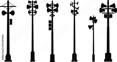 Outdoor loudspeaker pole silhouettes, emergency alert system, public address speakers, communication tower, industrial sound equipment, warning siren, disaster preparedness, urban infrastructure