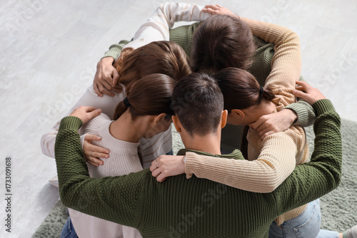 Group of hugging people pra...