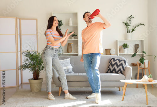 Young couple with portable ...