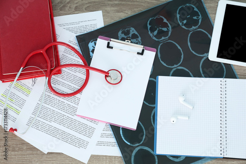Medical student's study materials on table, top view