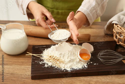 Woman sifting flour for pre...