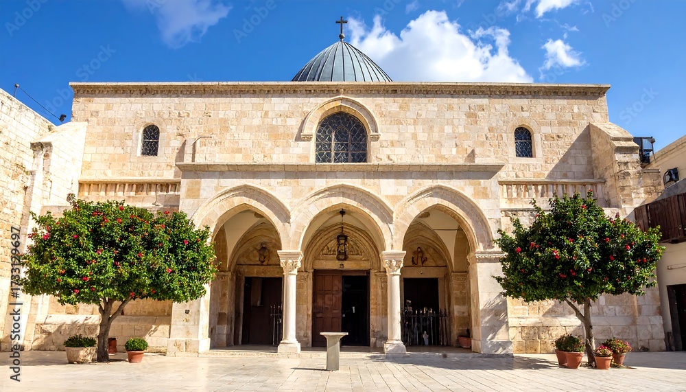 Fototapeta premium Exterior of a light beige stone church with a dome