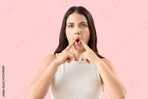 Young woman doing face buil...