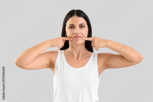 Young woman doing face buil...