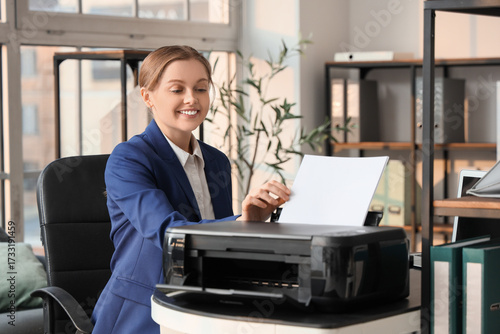 Young businesswoman using p...