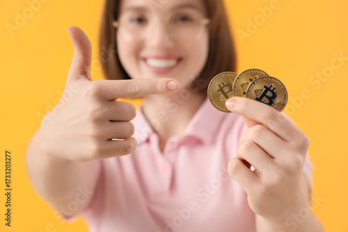 Young woman pointing at bit...