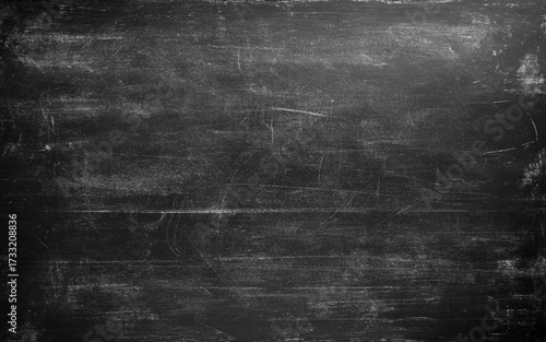 Dark cement wall in retro concept. Black concrete background for wallpaper or graphic design. Blank old plaster texture in vintage style. Abstract surface with unusual beautiful patterns.