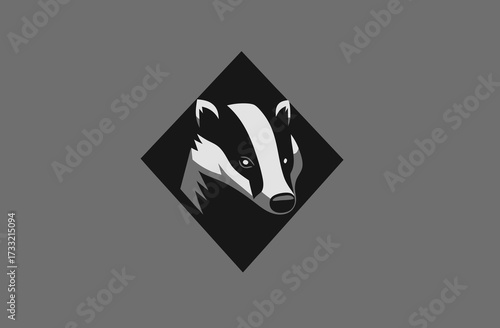 Stylized black and white badger head illustration in a geometric diamond shape, animal logo concept on a grey background
