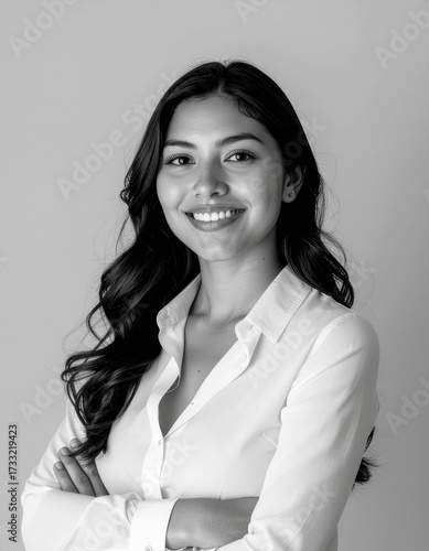 approachable latina coo half-body portrait crisp white blouse warm executive presence corporate communications and diversity-led leadership imagery
