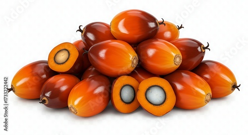 Close-up shot showcasing a pile of vibrant palm fruits, with some cut open to reveal the seed