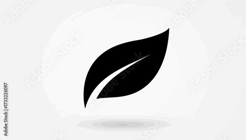 A single black leaf silhouette is centered against a plain white background, casting a subtle shadow.