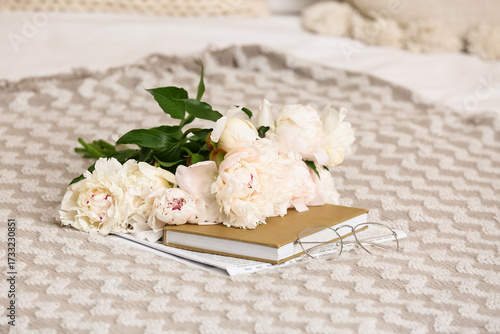 Peony flowers with book and...