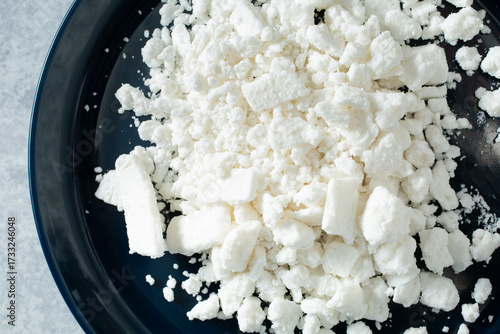 Photography A top down view of a pile of dairy-free feta cheese crumbles.
