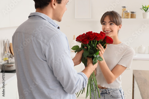 Young woman receiving red r...
