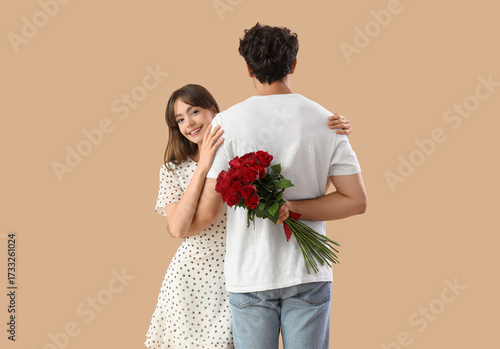 Young couple with red roses...