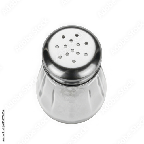 Clear glass salt shaker with metal top isolated on black