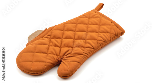 Essential kitchen protection a warm orange quilted oven mitt, a crucial utensil for safely managing heat during various baking and cooking endeavors, isolated on a clean white background