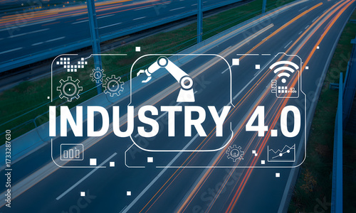 Industry 4.0 concept with robotic arm and technology icons over blurred highway traffic at night.
