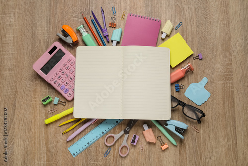 Open blank notebook surroun...