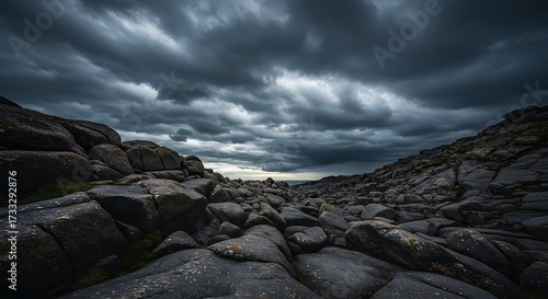 Dramatic dark sky and rugged rocky terrain landscape scene