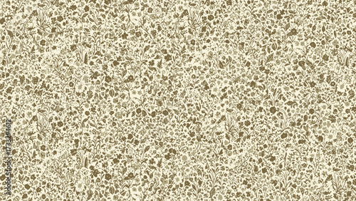 A detailed close-up of a beige speckled composite surface with brown and cream aggregate, resembling terrazzo or quartz.