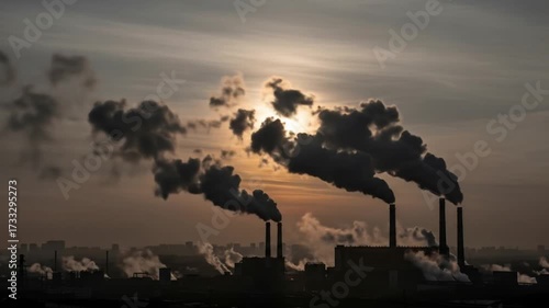 Smoky factory emissions obscuring sunrise