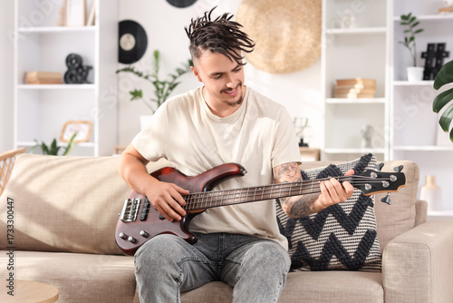 Young man with dreadlocks p...