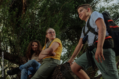 Young explorers observing nature during an adventurous hike