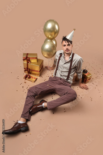 Cool young man with gifts c...