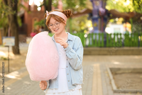 Teen girl with cotton candy...