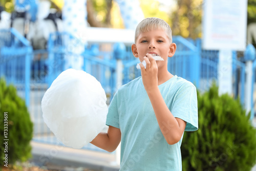 Teen boy eating cotton cand...
