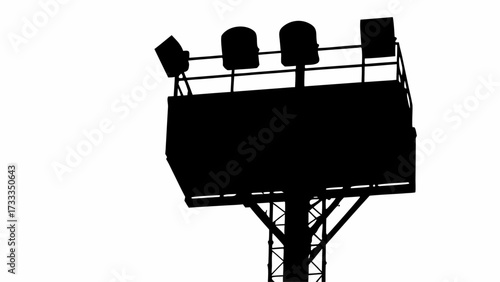 Dramatic silhouette of a powerful stadium spotlight tower casting intense light for nighttime sports events and concerts