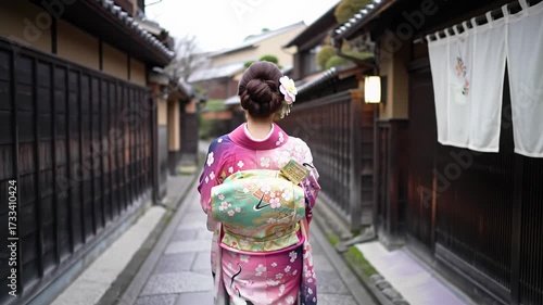 A graceful young east asian woman in a vibrant fuchsia, indigo, gold silk kimono walks through a secluded kyoto *roji* alley, soft afternoon light. Profound traditional beauty of ancient japan