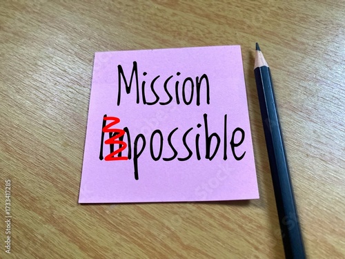 A pink sticky note has the word 