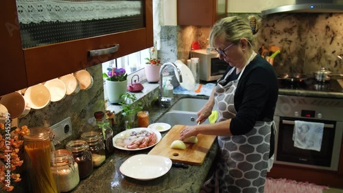 Housewife cooking fish stew at home. High quality 4k footage