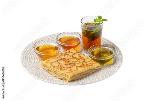 Moroccan Crepes (Msemen) with Honey and Mint Tea on White